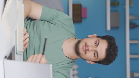 Vertical-video-of-Phone-Addicted-male-student.