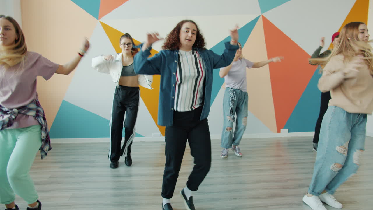 Teenagers Dancing in a Dance Studio