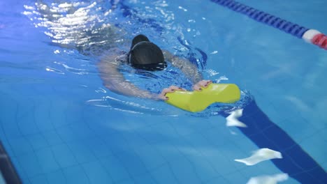 sporty young woman swimming in pool
