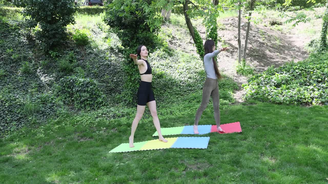 Women doing fitness exercises outdoors