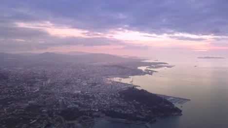 aerial view of the important city of vigo at summer sunset with beautiful colors in the sky and cinematic movement
