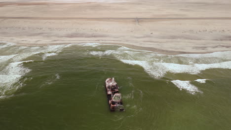 aerial view of a shipwreck on the skeleton coast, namibia