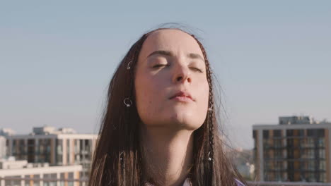 Close-up-view-of-brunette-woman-on-a-terrace