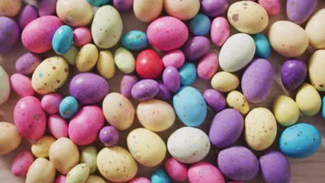 video of decorated colorful easter eggs on a wooden surface