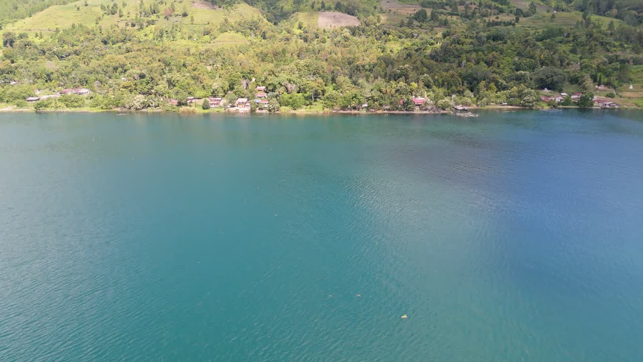 Drone shots revealing scenery of Lake Toba in Sumatra
