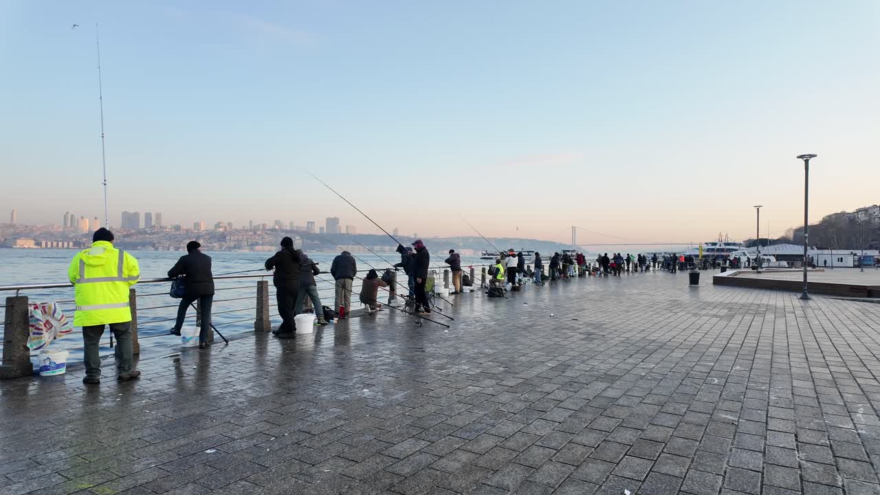 People Fishing on a Pier in Istanbul at Sunrise