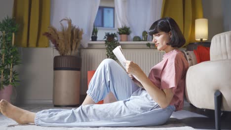 the woman reading the newspaper.