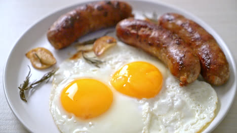 homemade double fried egg with fried pork sausage - for breakfast