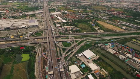 Logistic-concept-aerial-view-of-futuristic-autonomous-traffic-on-the-elevated-expressway-with-driverless-cars-using-artificial-intelligence-computer-network-and-satellite-gps-for-navigation