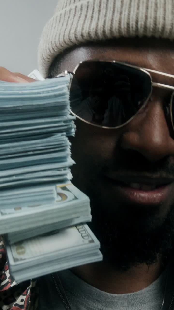 Man holding stacks of money