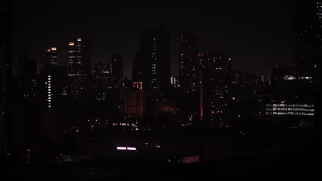 lights sparkling from individual houses and apartments from various buildings in the skyline