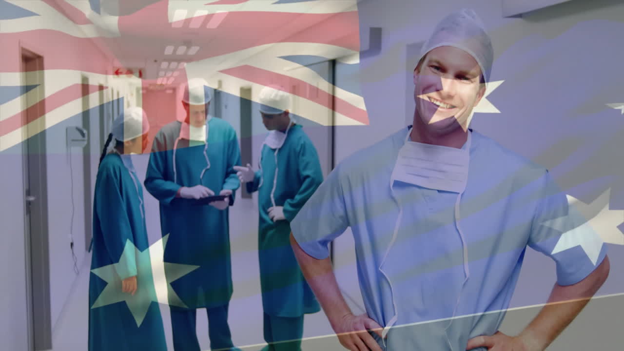 Animation of flag of australia over caucasian surgeons smiling and talking