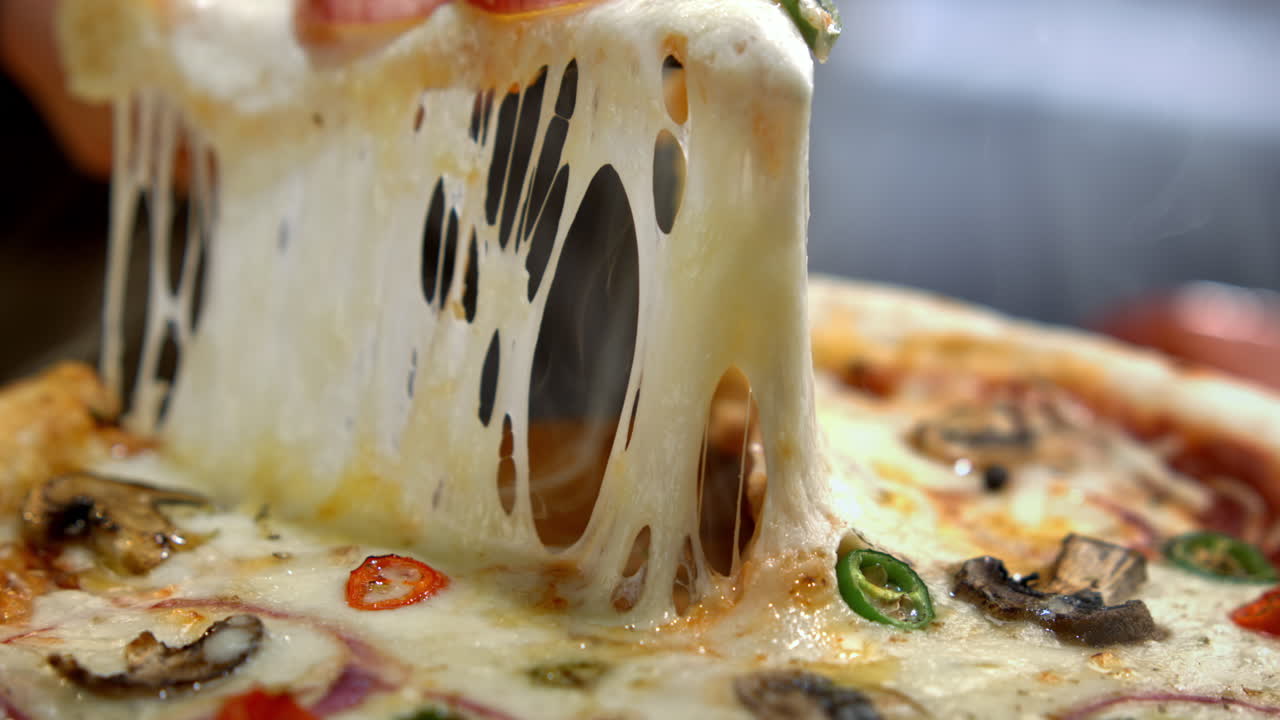 Delicious pizza with melting cheese