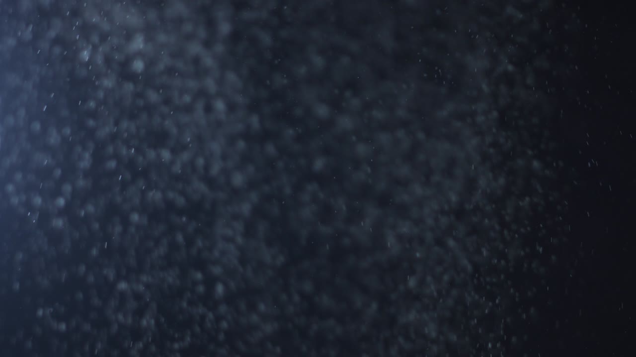 fondo negro de 4k de partículas, polvo y humo en movimiento