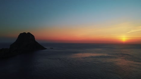 aerial: beautiful sunset over the mediterranean sea in ibiza, spain