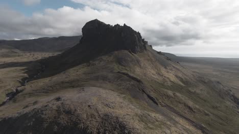 Aerial-flying-above-west-Iceland,-towards-spectacular-mountain-summit