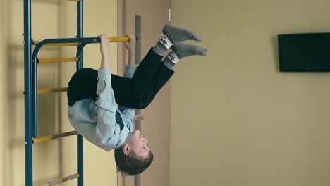 slow motion boy in school uniform makes a coup on the sports ladder