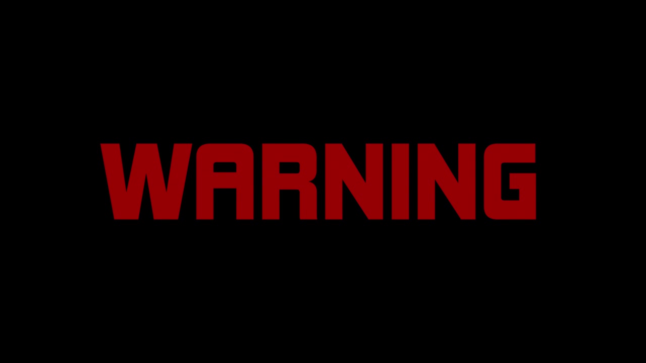 Red flashing warning text message, appearing against a black background
