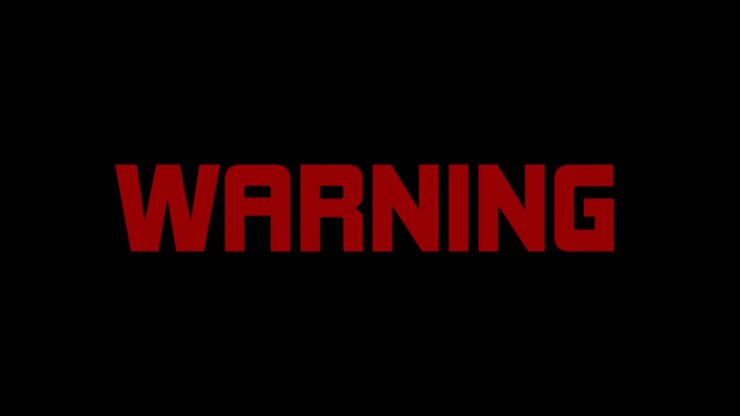 Red flashing warning text message, appearing against a black background