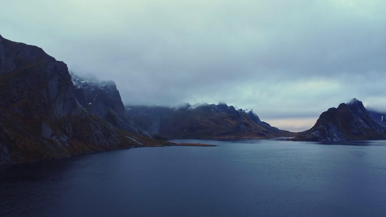 Picturesque drone view of scenic fjord under gloomy sky