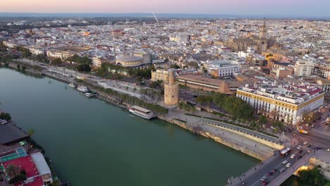 torre del oro or golden tower, dodecagonal military watchtower in seville spain aerial drone shot view