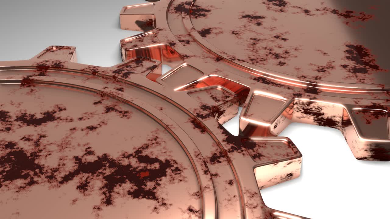 Two golden metallic gears rotation. Mechanism in motion.