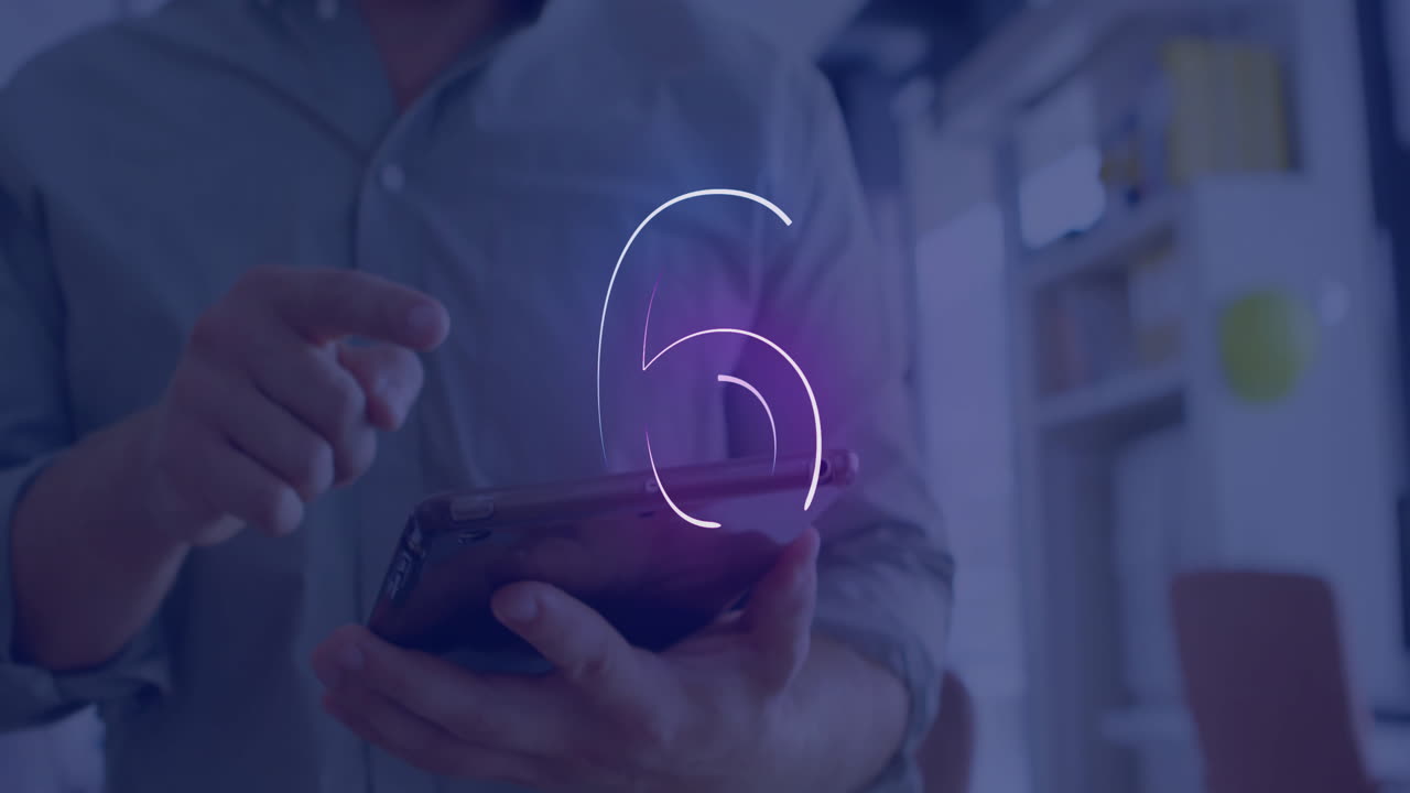 Using tablet with number five animation overlay, person focused on screen