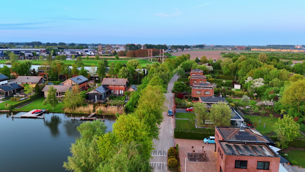 Green village with multiple canals. Drone flight over Vinkeveen, the Netherlands.