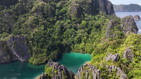 big lagoon kayaking in el nido, philippines. dramatic rocky islands, with crystal clear waters.