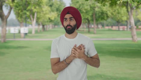 sick sikh indian man having an heart attack in park