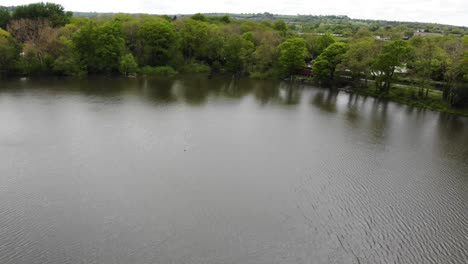 aerial panning right shot over chard reservoir south west england uk