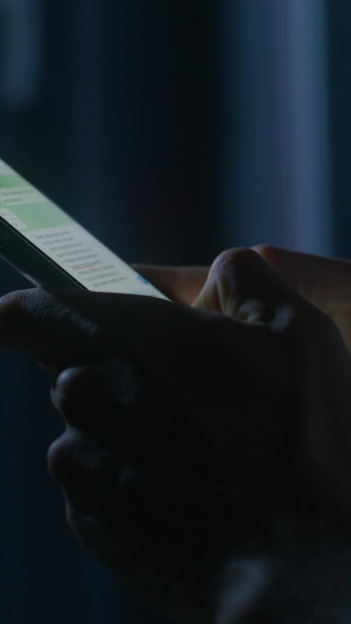 Person using a smartphone at night