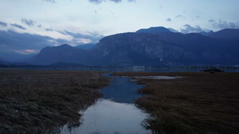 drone fly above small water river with nature landscape in canada squamish spit conservation area