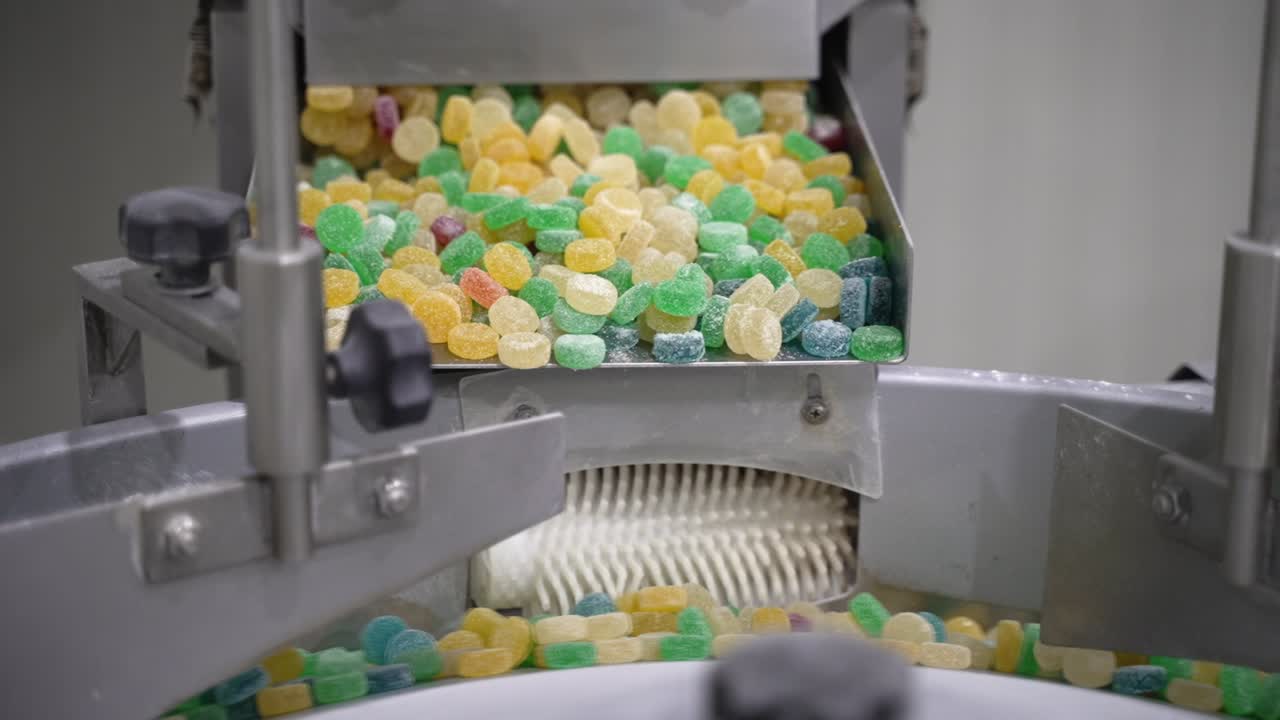 Gummies , jelly beans in various colours to be sorted on an automated industrial machine