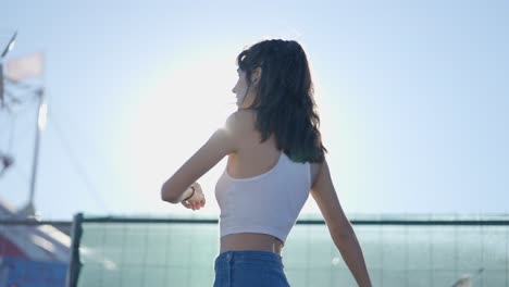young women dancing outdoors on a sunny day