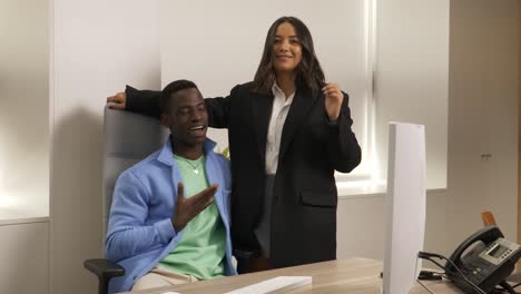 business colleagues sharing laughter and dancing in office