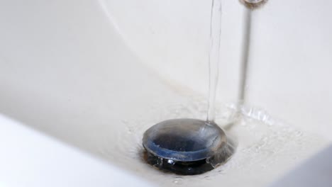 water running into sink drain