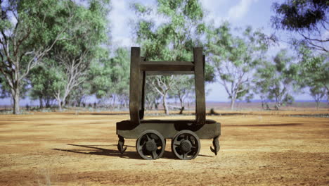 rustic transport cart resting under the shade of sprawling eucalyptus trees