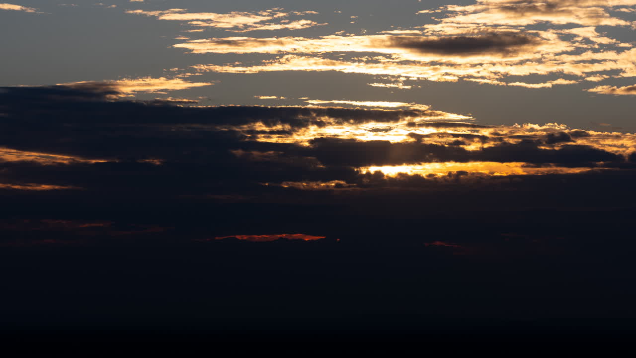 Sunlight Breaking Through Clouds at Golden Hour