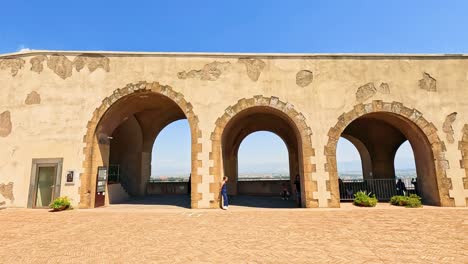 arched architecture with a distant sea view