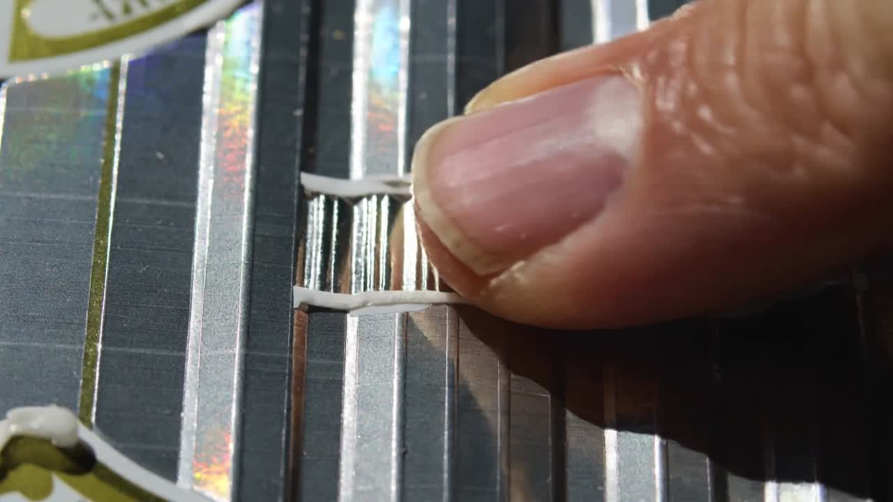 Approaching tip pressing aligning stacked rings with spacer into grooved panel at bench seating