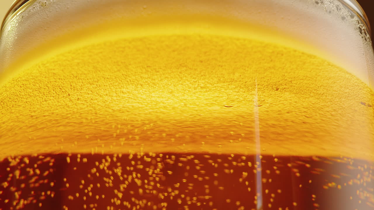 Close-up of a beer glass with foam