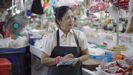 woman seller at a bustling asian market