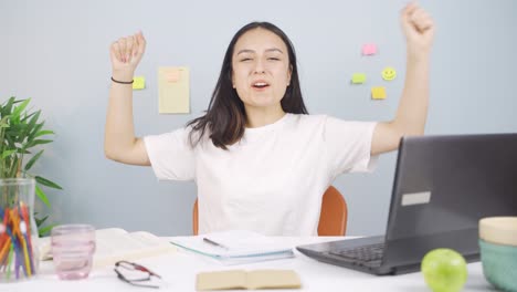 Female-student-experiencing-joy-looking-at-camera.