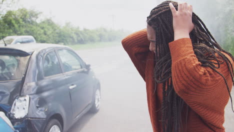 female motorist with whiplash injury getting out of car after crash