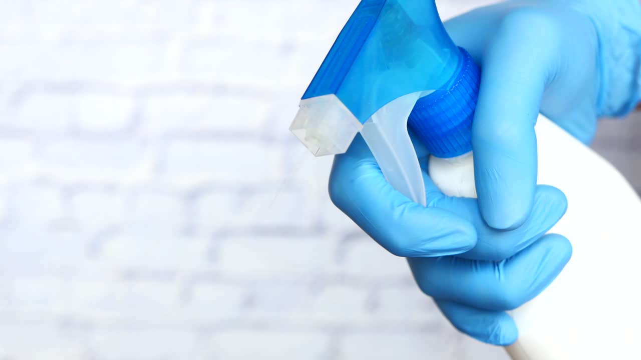 Cleaning with Spray Bottle and Gloves