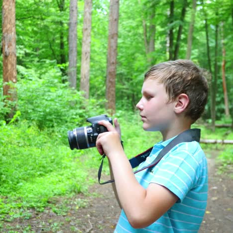 boy in wilderness area taking picture