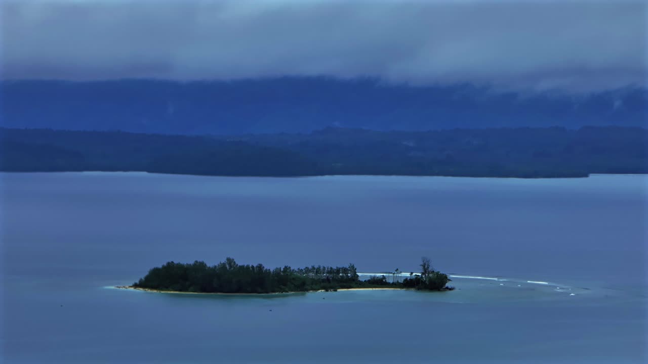 Mushi Yuo Sand Island untouched pristine remote island harbor view Wewak Papua New Guinea PNG aerial drone early morning rain fog clouds summer dry season Cape Wom Public beach static shot