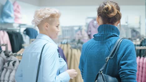 women shopping for clothes in a store