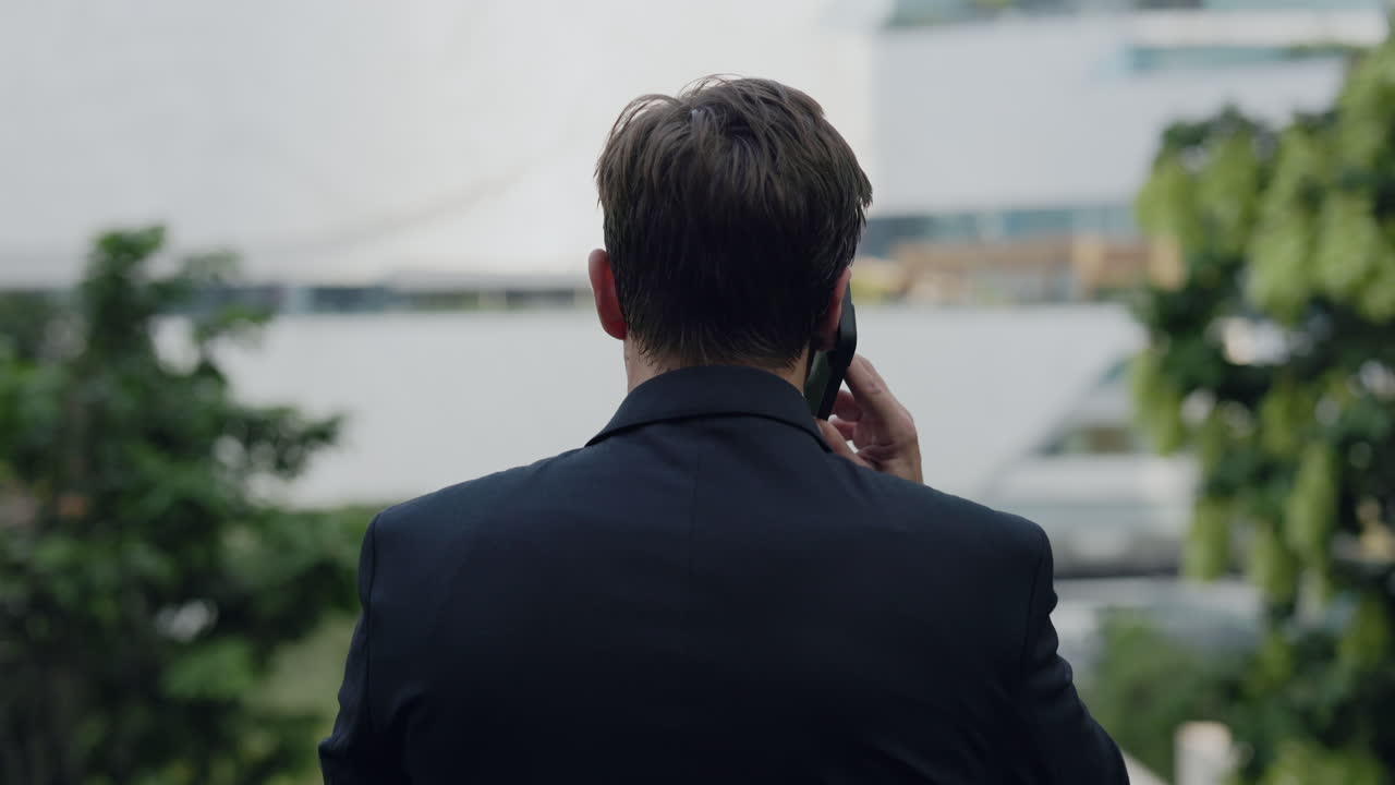 Businessman Talking on the Phone Outdoors
